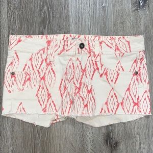 Cream shorts with red design